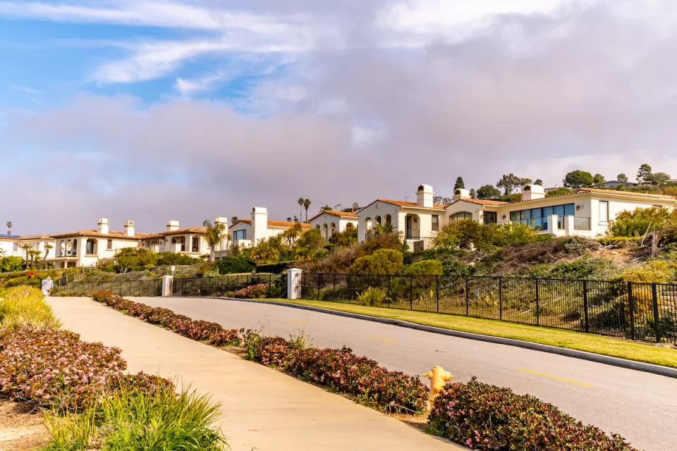 Row of white Spanish Revival-style homes in Torrance, California.